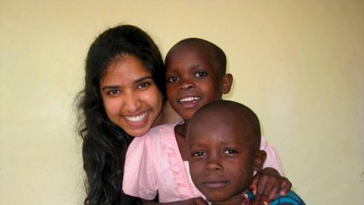 Rashmi Jasrasaria ’10 investigated several topics, including some research that involved visiting partner organizations of the Arusha Project, the nongovernmental organization (NGO) that was hosting her as a researcher. Here, she is shown with two children who attend the Baraa Orphanage and Nursery School, whose directors are both HIV-positive.
