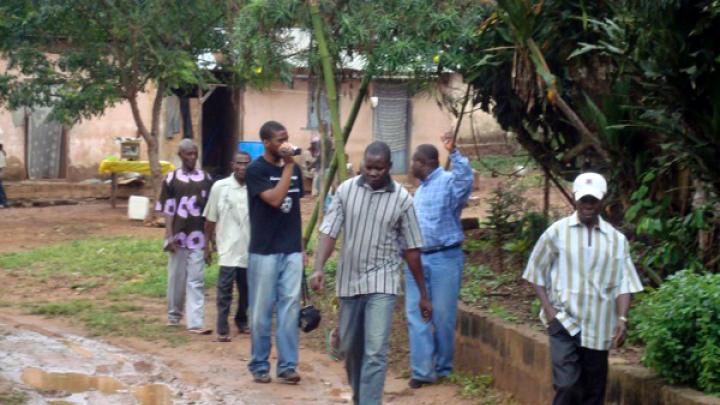 Walking with Agyementi village leaders, Sangu Delle ’10 scouts out the village in 2008 in preparation for installing a borehole there. His project, an alternative thesis for the African studies concentration, has brought clean water to a population of 2,000 that previously used a water source designed for 300.