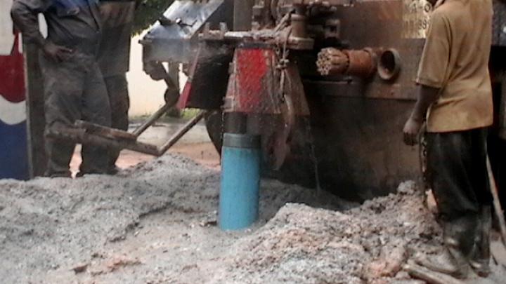 Drilling 80 feet into the ground to tap water for the borehole