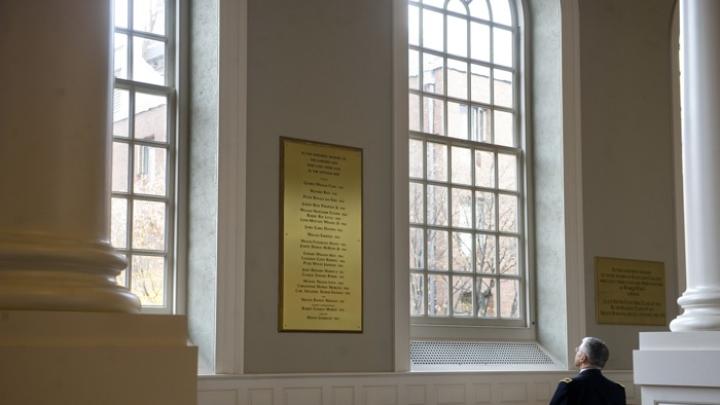 U.S. Army Chief of Staff George W. Casey Jr. views the plaque in Memorial Church honoring Harvard’s Vietnam War dead—among them his father, George W. Casey ’45.