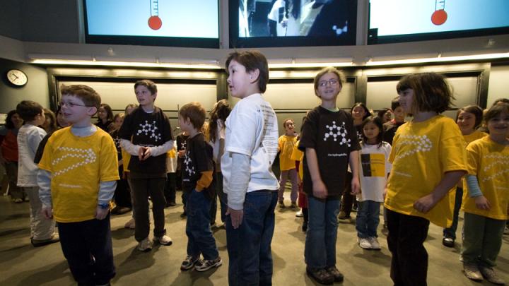 Another group of volunteers demonstrates phase changes: solid... 