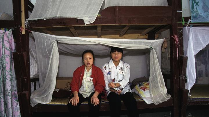 Factory girls in their dormitory, Guangdong Province