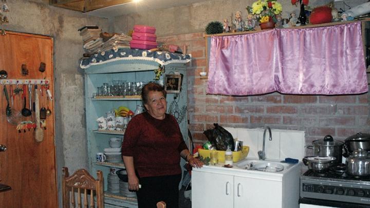 Rosa Estrella Ortega Roa has big plans for the unit where she lives with her two-year-old grandson. Although the walls and ceiling of her kitchen are still unfinished... [click the images below for more]