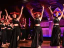 Students performing dance on stage