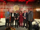 The "Fab Five of Harvard Sports" panelists: (left to right) Ben Crockett ’02, Allison Feaster ’98, Don Sweeney ’88, and Jessica Gelman ’97, M.B.A. ’02, alongside Harvard Club president Marcus O.P. DeFlorimonte PMD '95.