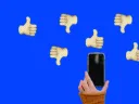 Montage illustration of person holding a phone with thumbs up and down in the background