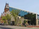 Photograph of the back side of Gund Hall with Memorial Church in the background