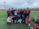 members of the Harvard cricket team pictured before a game on a field