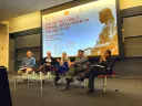 Photograph of participants in a symposium on AI at Harvard