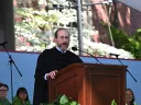 Alan Garber stands at podium under tent