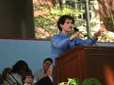Man at podium addressing audience