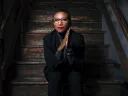 Portrait of Kimberly Dowdell sitting on steps