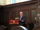 Harvard President Alan Garber at a podium in Memorial Church
