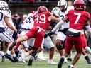 Harvard player #39 tackles Yale player 