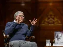 Bill Gates delivers comments at Harvard University, his memoir Source Code displayed