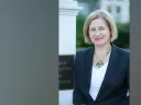 Ann Marie Lipinski stands at the entrance to the Nieman Foundation