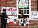 Student protestor and Harvard police officer during the Mass Hall living-wage protest, April 25, 2001