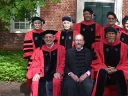 Back row from left: Rita Moreno, Elaine H. Kim, Abraham Verghese, Richard Alley, and  Esther Duflo  Front row from left: Provost John F. Manning, President Alan M. Garber, and Kareem Abdul-Jabbar