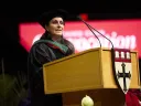 Céline R. Gounder speaks at a podium