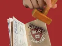  passport with a Harvard shield being stamped "No entry" 