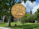 Pulitzer Prize in the foreground with Radcliffe Institute in the background 