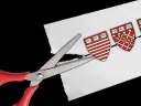 scissors cutting a paper with Harvard shields on a dotted line 