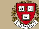 Harvard University crest featuring a shield with books and the words "VERITAS" and "HARVARD".
