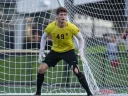 Soccer player and goalkeeper Matt Freese standing in front of the net