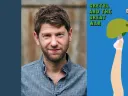 Portrait of a man in a denim shirt beside a blue book cover for "Gretal and the Great War" featuring an illustration of a leg holding an army helmet..