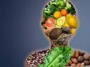 Silhouette of a human body comprised of food groups: fruit, nuts, legumes, vegetables, whole grains