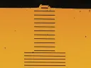 Wavelength scale grating (above) on the facet of a tiny semiconductor laser (below) creates multiple laser beams parallel to the original.