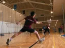 A badminton rally in progress at the Malkin Athletic Center. 