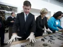 Harvard University president Drew Faust and Boston mayor Martin J. Walsh participate in a community art project at the opening of the Ed Portal’s new building in Allston.