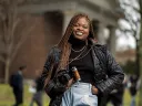 Dumb Menakaya standing on campus with her camera