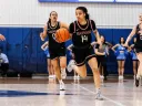Harmoni Turner dribbles the ball up the court 