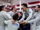 fencers celebrate a championship win