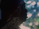 A still image from the film, This is Love, showing Rudy Love in shadowed profile