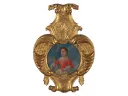 portrait of young girl surrounded by ornate gold-painted frame