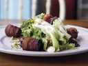 Tangy greens with bacon-wrapped dates