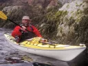 John Huth navigating through a rock slot of Placentia Island in coastal Maine 