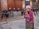 A Tibetan woman praying at the Boudhanath Stupa, near Kathmandu