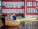 Graham McKay (front) with Jim Heller and Justin Kennick launching one of the shop's boats on the Merrimack River