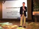 Jason Rosenfeld delivers a presentation with microphone in hand