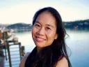 Photo of Bonnie Tsui standing on a pier