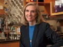 Kari Nadeau sits in her lab