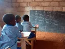 Students learn about computer skills in a classroom at Christ is the Answer Preparatory School in Adansi-Dompoase, outside Kumasi. According to school proprietor Anthony Kwasi Nyarku, private schools such as his are superior to Ghanaian public schools because the government-run schools are often under-supervised and a strong union protects the sometimes negligent teachers.