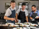 Chef/owner Alex Crabb shares the open kitchen with fellow cooks Tyson Wardwell and Nathan &ldquo;Lazer&rdquo; Phinisee.