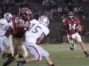 Hard-running quarterback Conner Hempel (14) gives Harvard’s ground game an added dimension. Hempel ran the ball 11 times as Harvard overcame Brown, 41-23.