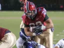 Only 4:09 minutes into the game, surprise Crimson starter Andrew Casten scored the season's first points--and the first of his three touchdowns—on a three-yard plunge. Casten averaged nine yards a carry.