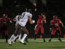 Charlie Dean throws a football across field.